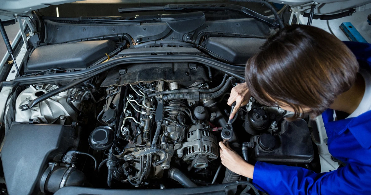 A women fixing car